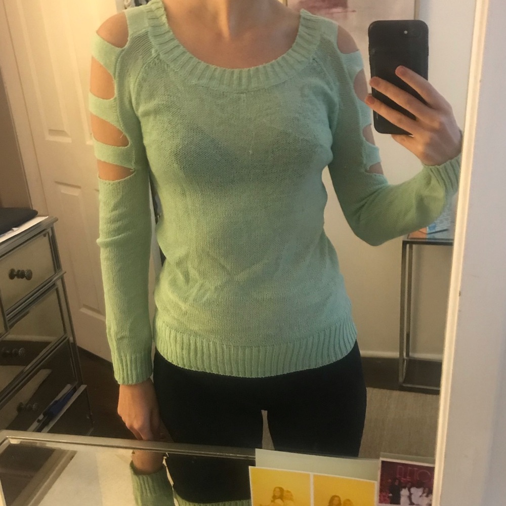 Green sweater with cut outs on shoulders